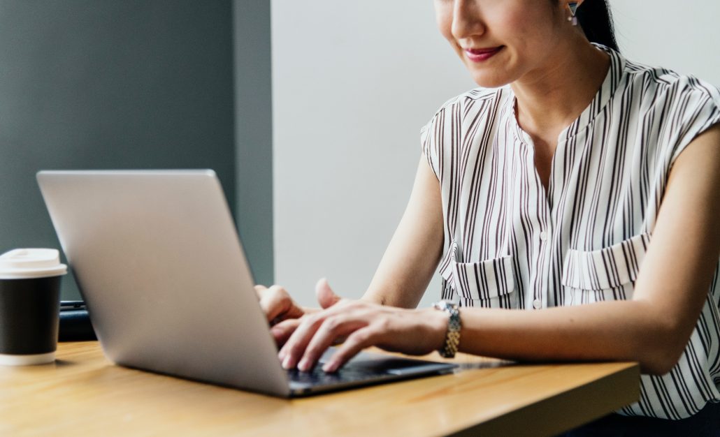 research administrator using laptop for fiscal monitoring